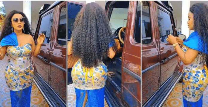 Nana Ama Mcbrown rocks a stylish dress as she flaunts her expensive G-Wagon