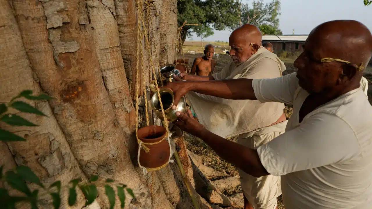 Relatives perform the last rites of three villagers who died due to heat related ailments in Ballia district, Uttar Pradesh state, on June 19, 2023.