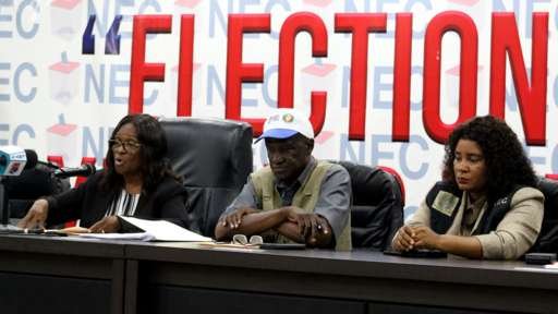 Liberia’s president and opposition engage in closely contested race